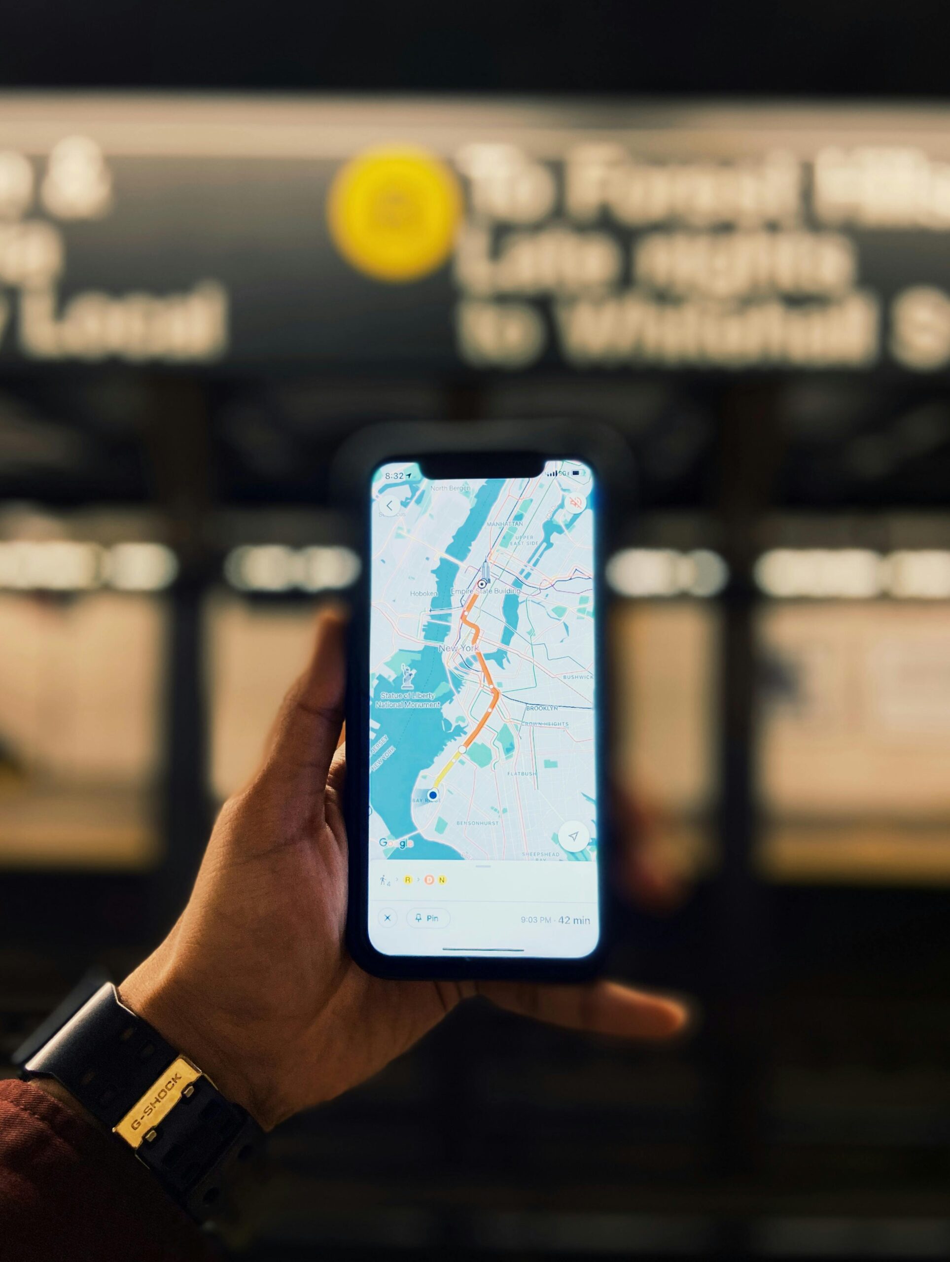 Hand holding a phone with Google maps displayed