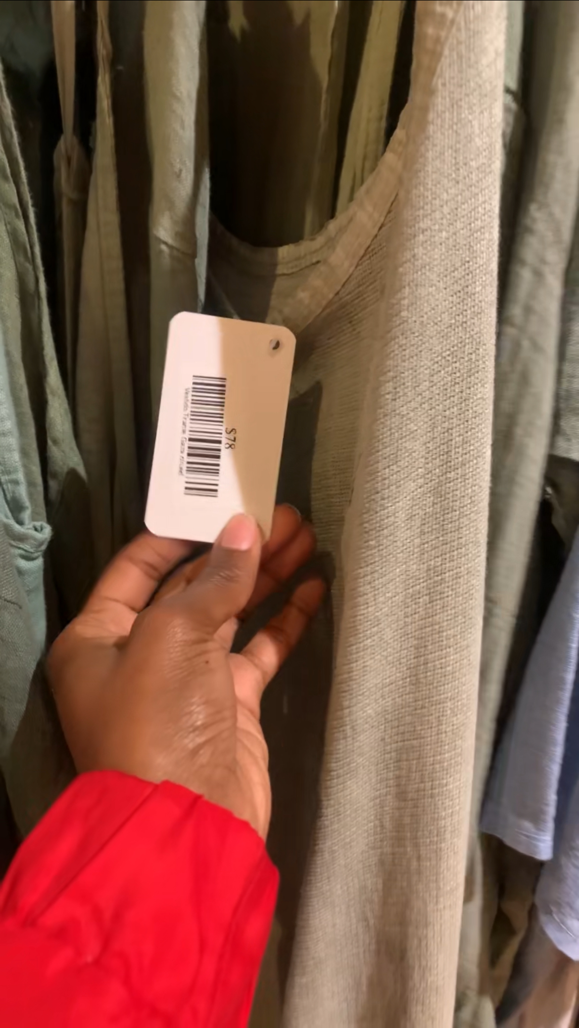 Price tag of seventy-eight dollars attached to a dress.